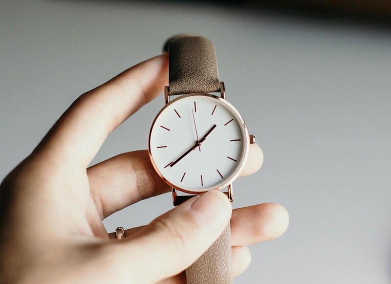 A hand showing a simple watch